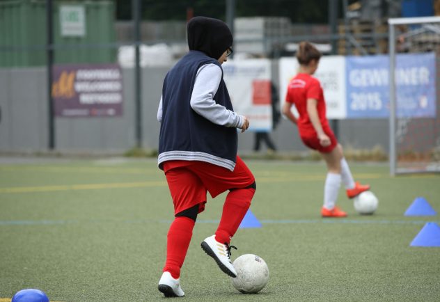 Merkel Visits Integration Project For Young Women Through Football